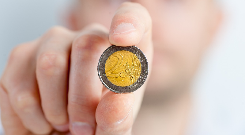holding a coin - 800x440